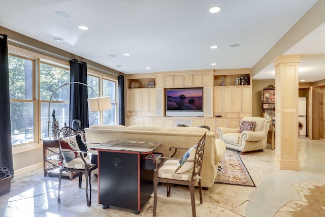 10025 Adam Ave, Inver Grove Heights, MN 55077 - living area featuring estacked washer and dryer, decorative columns, and recessed lighting