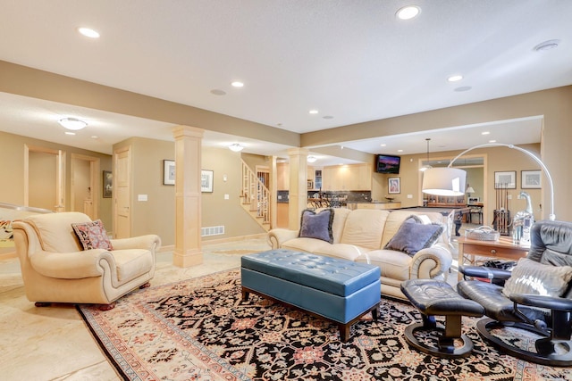 10025 Adam Ave, Inver Grove Heights, MN 55077 - living room featuring decorative columns, stairs, and recessed lighting