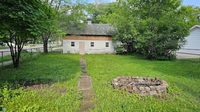 1602 11th St N, Fargo, ND 58102 - view of yard featuring an outdoor fire pit and an outbuilding