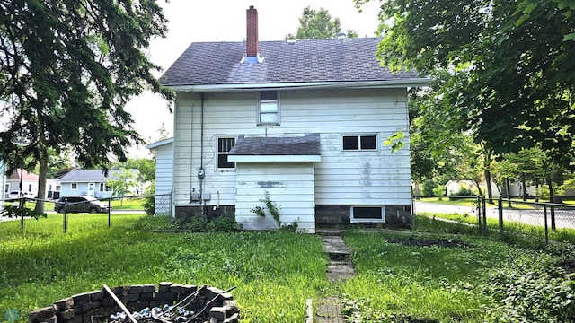 1602 11th St N, Fargo, ND 58102 - rear view of property with a chimney