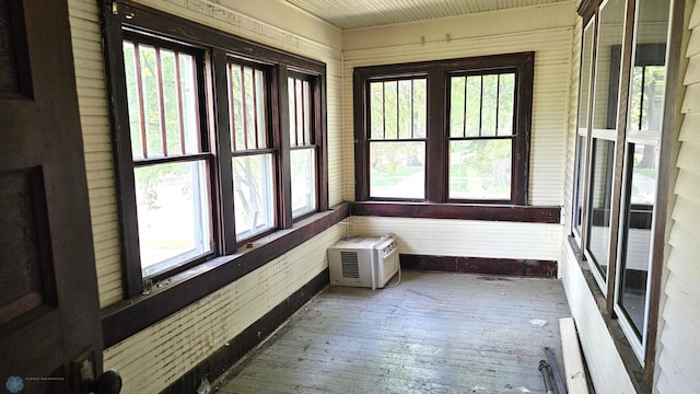 1602 11th St N, Fargo, ND 58102 - unfurnished sunroom with hardwood / wood-style floors and a wall mounted AC