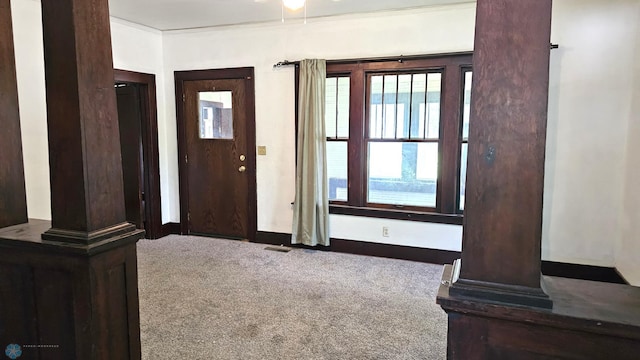 1602 11th St N, Fargo, ND 58102 - entryway featuring carpet floors, ornate columns, and baseboards