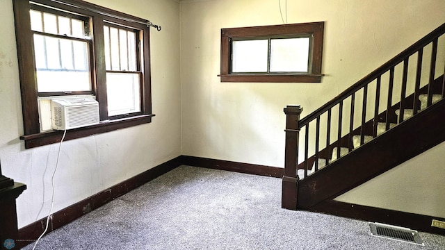 1602 11th St N, Fargo, ND 58102 - staircase with carpet floors, plenty of natural light, and baseboards