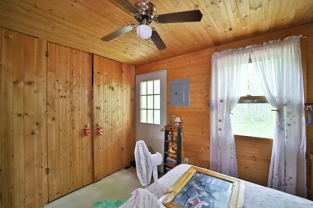 19489 Blue Ln E, Emily, MN 56447 - bedroom with wooden walls, electric panel, concrete floors, wooden ceiling, and a ceiling fan