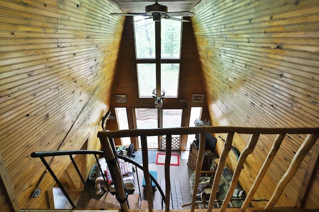 19489 Blue Ln E, Emily, MN 56447 - stairs featuring a ceiling fan and wood walls