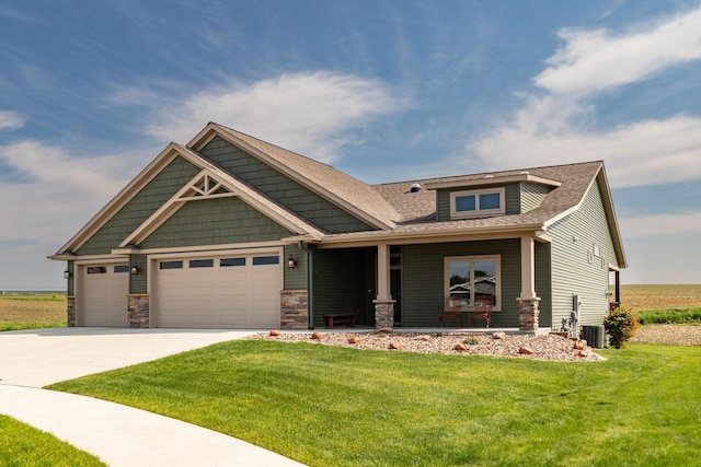 2238 Marvs Ln NE, Stewartville, MN 55976 - craftsman-style house featuring an attached garage, a front yard, driveway, stone siding, and a porch