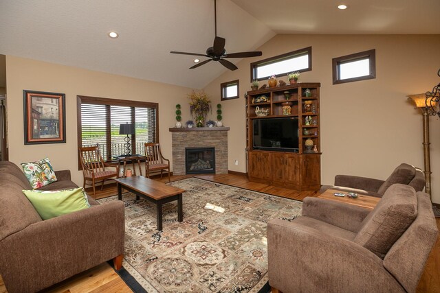 2238 Marvs Ln NE, Stewartville, MN 55976 - living area with wood finished floors, ceiling fan, a fireplace, high vaulted ceiling, and recessed lighting