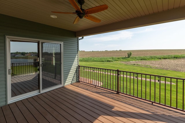 2238 Marvs Ln NE, Stewartville, MN 55976 - wooden deck with ceiling fan, a view of countryside, and a lawn