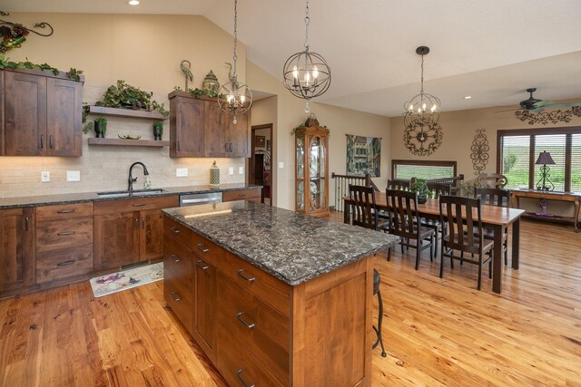 2238 Marvs Ln NE, Stewartville, MN 55976 - kitchen with a sink, open shelves, light wood-style floors, dishwasher, and vaulted ceiling