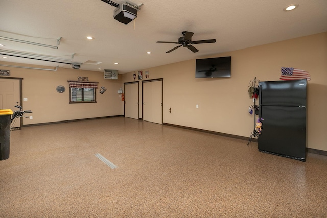 2238 Marvs Ln NE, Stewartville, MN 55976 - garage with freestanding refrigerator, a garage door opener, baseboards, recessed lighting, and ceiling fan