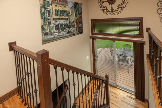 2238 Marvs Ln NE, Stewartville, MN 55976 - stairs featuring wood finished floors and baseboards
