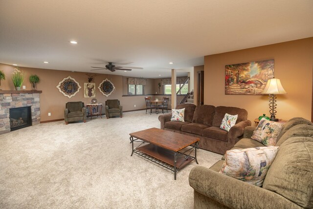 2238 Marvs Ln NE, Stewartville, MN 55976 - living area featuring recessed lighting, light colored carpet, a stone fireplace, a ceiling fan, and baseboards