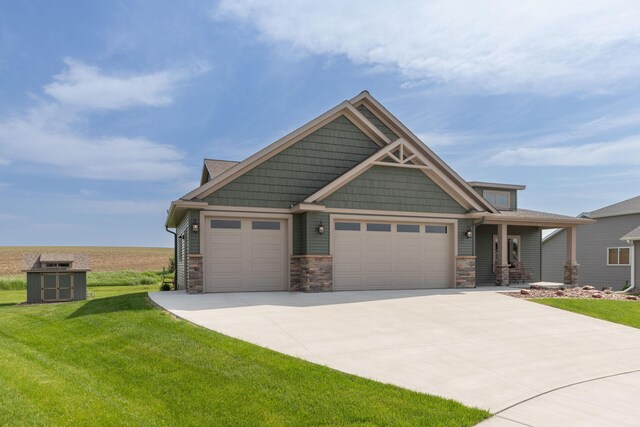 2238 Marvs Ln NE, Stewartville, MN 55976 - craftsman inspired home with stone siding, a front yard, an attached garage, and concrete driveway