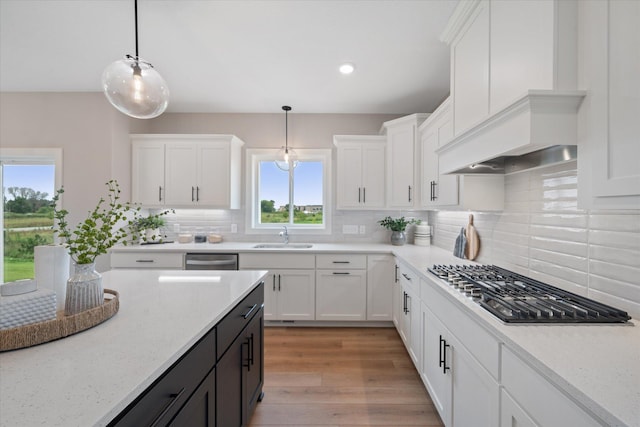 4980 Kyla Way SE, Prior Lake, MN 55372 - kitchen with appliances with stainless steel finishes, white cabinetry, decorative light fixtures, tasteful backsplash, and recessed lighting