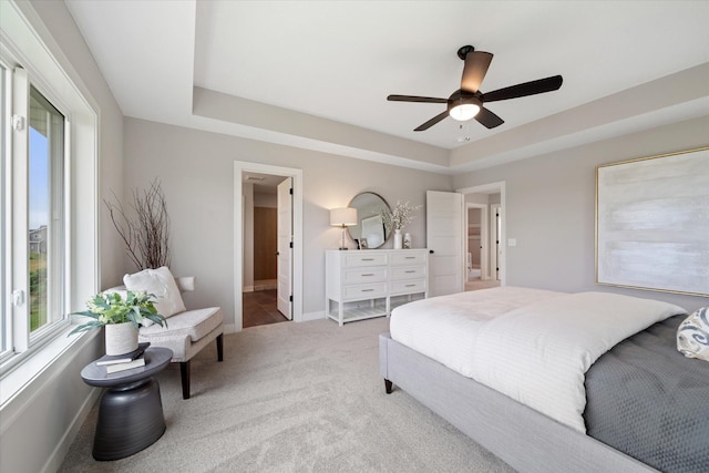 4980 Kyla Way SE, Prior Lake, MN 55372 - bedroom with multiple windows, carpet floors, ceiling fan, and a tray ceiling