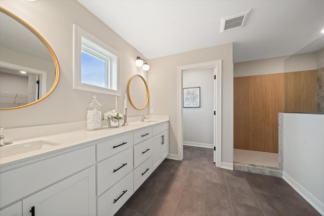 4980 Kyla Way SE, Prior Lake, MN 55372 - bathroom featuring double vanity, a walk in shower, and tile patterned flooring