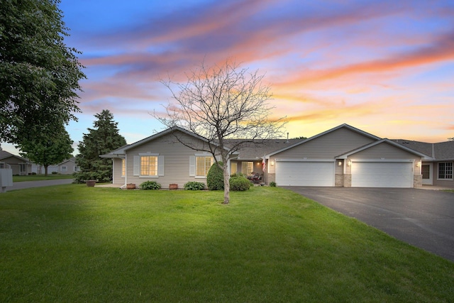 6103 150th St N, Hugo, MN 55038 - ranch-style house featuring asphalt driveway, an attached garage, and a front lawn