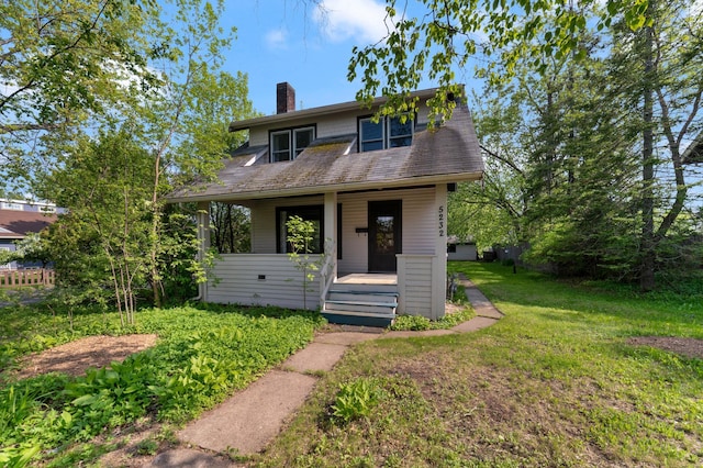 5232 Tioga St, Duluth, MN 55804 - bungalow featuring a porch, a chimney, and a front yard