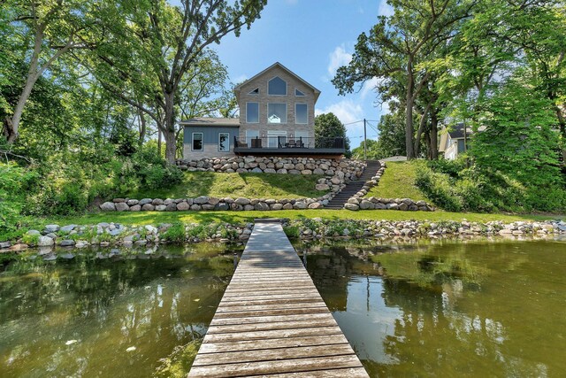 565 Brooks Lake Rd NW, Cokato, MN 55321 - dock featuring stairs, a yard, and a water view