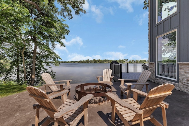 565 Brooks Lake Rd NW, Cokato, MN 55321 - view of patio / terrace featuring an outdoor fire pit and a water view