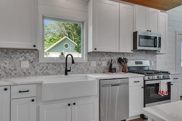 565 Brooks Lake Rd NW, Cokato, MN 55321 - kitchen with appliances with stainless steel finishes, tasteful backsplash, and light countertops