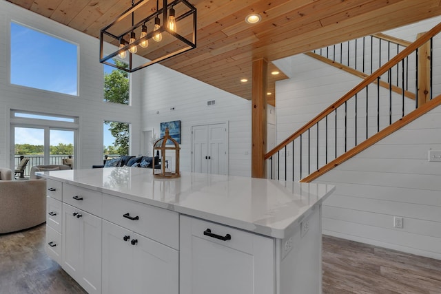 565 Brooks Lake Rd NW, Cokato, MN 55321 - kitchen with open floor plan, high vaulted ceiling, a chandelier, dark wood-style floors, and wood ceiling
