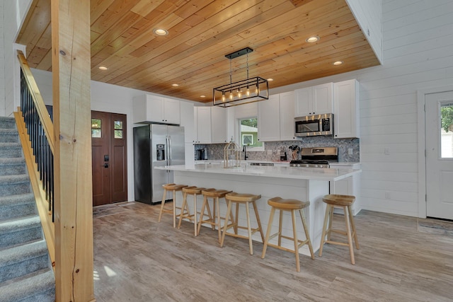 565 Brooks Lake Rd NW, Cokato, MN 55321 - kitchen featuring stainless steel appliances, wood ceiling, recessed lighting, light countertops, and healthy amount of natural light