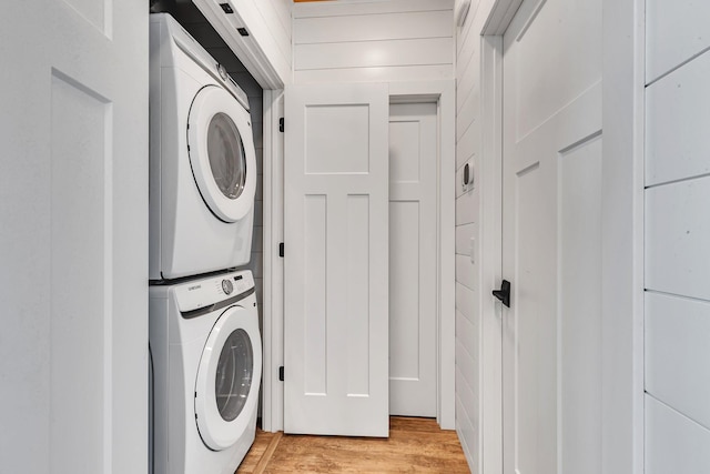 565 Brooks Lake Rd NW, Cokato, MN 55321 - laundry room with stacked washer / dryer and light wood finished floors