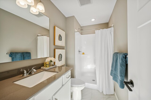 129 Terning Way, Howard Lake, MN 55349 - full bathroom with vanity, toilet, marble finish flooring, and curtained shower