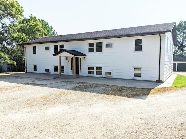 1101 Spring Creek Rd, Northfield, MN 55057 - view of front facade with a patio and roof with shingles