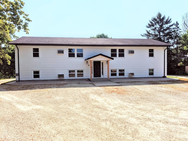 1101 Spring Creek Rd, Northfield, MN 55057 - bi-level home with a patio and a shingled roof