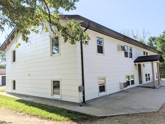 1101 Spring Creek Rd, Northfield, MN 55057 - view of side of home featuring a patio and cooling unit