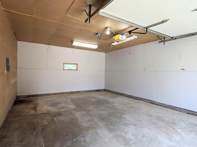 1101 Spring Creek Rd, Northfield, MN 55057 - garage with baseboards and a garage door opener