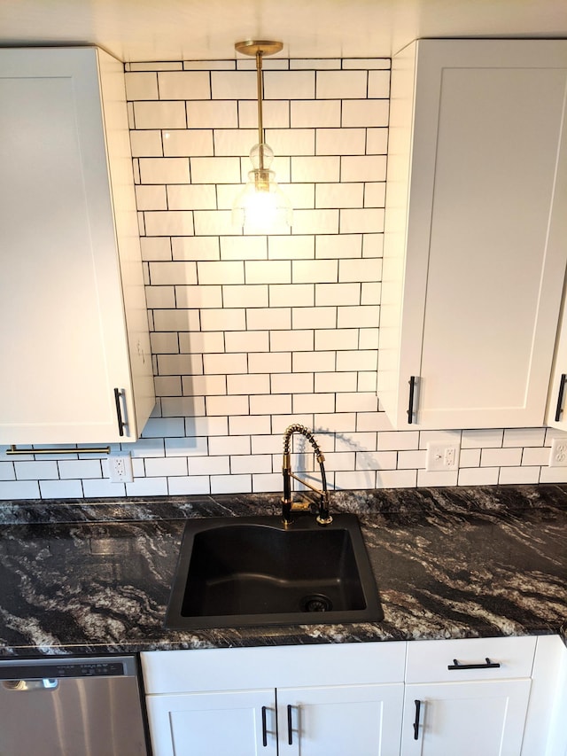 1101 Spring Creek Rd, Northfield, MN 55057 - kitchen featuring dishwasher, a sink, backsplash, and white cabinetry