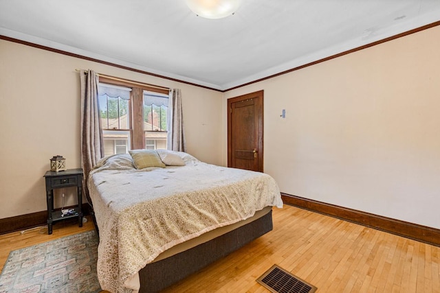 407 4th Ave SW, Faribault, MN 55021 - bedroom featuring light wood-style floors and crown molding