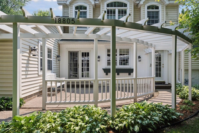 18805 Azure Rd, Deephaven, MN 55391 - doorway to property featuring a pergola