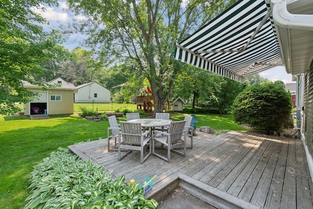 18805 Azure Rd, Deephaven, MN 55391 - wooden terrace with a storage unit and outdoor dining area