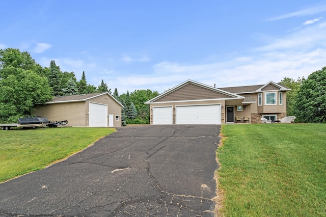 18125 Fillmore St NE, East Bethel, MN 55011 - split level home with a front lawn and stone siding