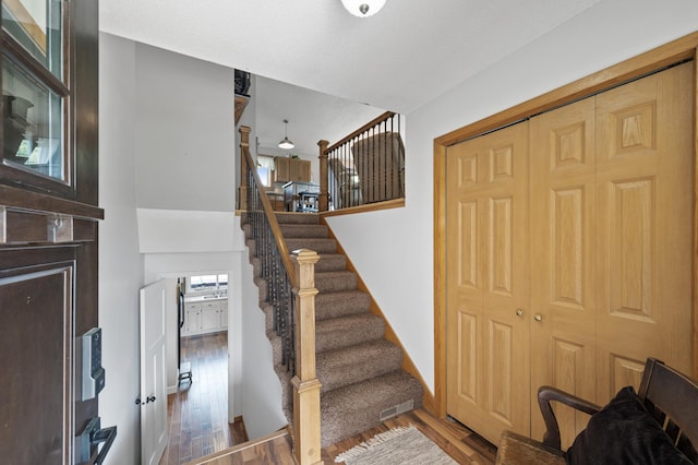 18125 Fillmore St NE, East Bethel, MN 55011 - staircase featuring wood finished floors