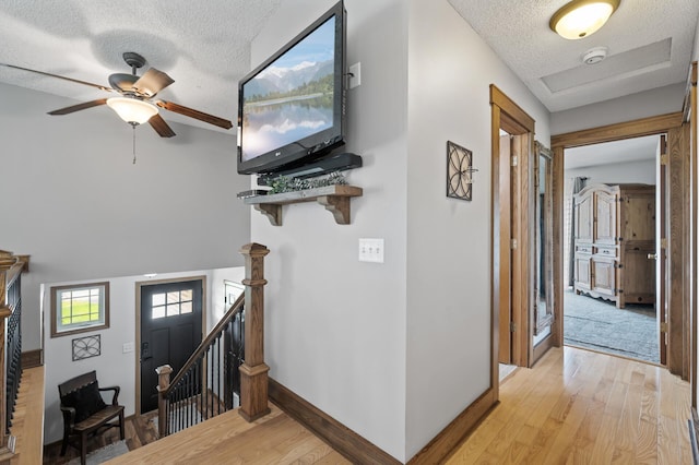 18125 Fillmore St NE, East Bethel, MN 55011 - entryway with a textured ceiling, light wood-style flooring, and ceiling fan