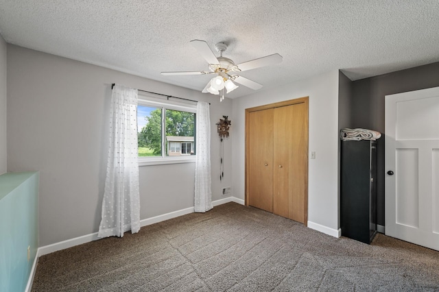18125 Fillmore St NE, East Bethel, MN 55011 - unfurnished bedroom with carpet flooring, ceiling fan, a textured ceiling, and a closet