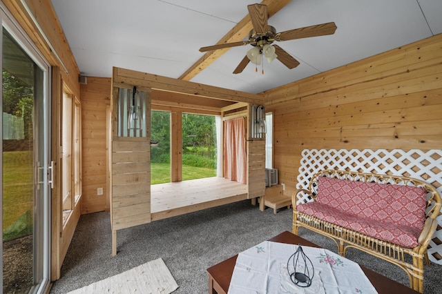 18125 Fillmore St NE, East Bethel, MN 55011 - carpeted bedroom featuring multiple windows, wood walls, and a ceiling fan