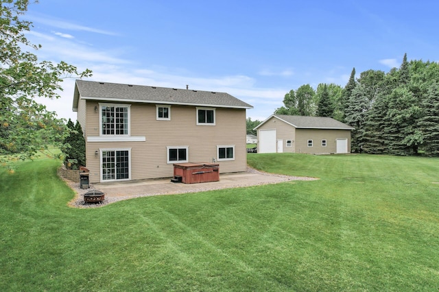 18125 Fillmore St NE, East Bethel, MN 55011 - back of property featuring a hot tub, a patio, a fire pit, and a yard