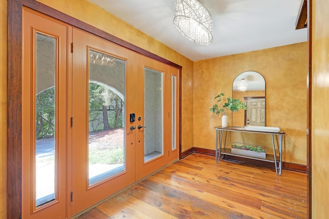 1919 Timberline Spur, Minnetonka, MN 55305 - doorway featuring hardwood / wood-style flooring, a chandelier, and french doors