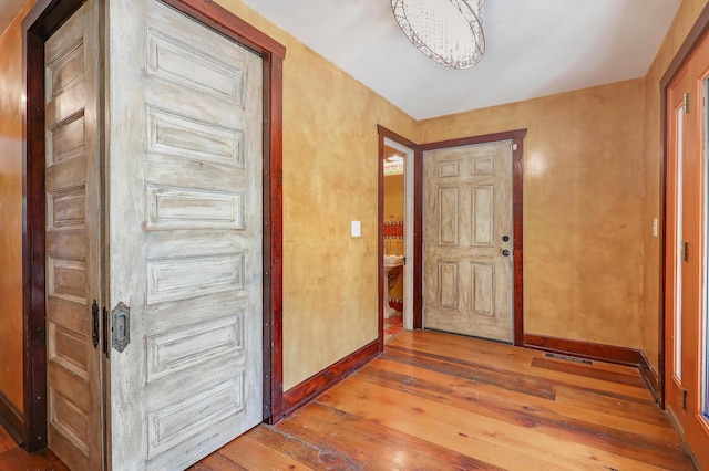 1919 Timberline Spur, Minnetonka, MN 55305 - entrance foyer with hardwood / wood-style flooring and a chandelier