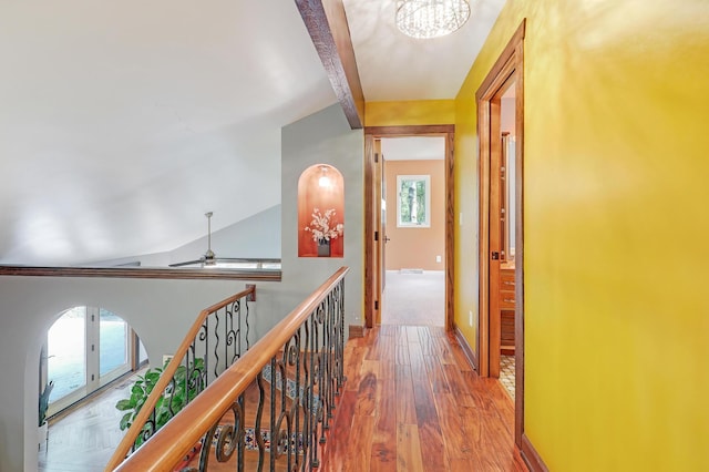 1919 Timberline Spur, Minnetonka, MN 55305 - hall with arched walkways, beamed ceiling, a chandelier, and wood finished floors
