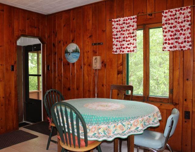 32704 310th Ln, Aitkin, MN 56431 - dining area featuring wooden walls and arched walkways