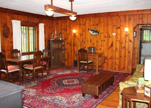 32704 310th Ln, Aitkin, MN 56431 - living area with wooden walls and wood finished floors