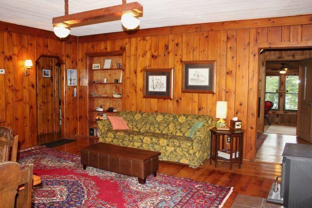 32704 310th Ln, Aitkin, MN 56431 - living area with wood finished floors and wood walls