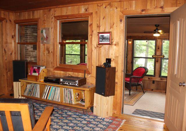 32704 310th Ln, Aitkin, MN 56431 - interior space with wood walls, plenty of natural light, and ceiling fan